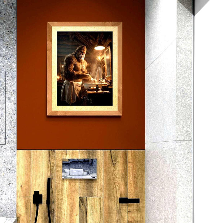 Unframed humorous Bigfoot bathroom poster featuring Sasquatch wrapped in a towel and shaving in a rustic log cabin bathroom. This playful wall art blends cryptid folklore with cozy mountain lodge décor, perfect for Smoky Mountains, Pacific Northwest, or Adirondack-style homes. Available in 8x10, 12x16, 16x20, and 18x24 inches.