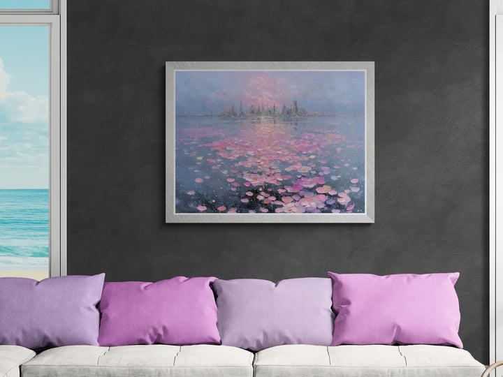 A romantic fantasy wall art depicting a glowing city and soft pink petals drifting across a mirrored lake at sunset.