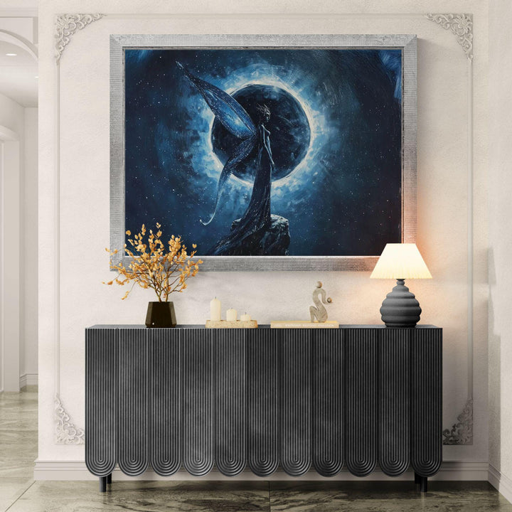Celestial fantasy wall art featuring a moon fairy with flowing wings standing before a glowing eclipse, surrounded by deep blue cosmic textures.