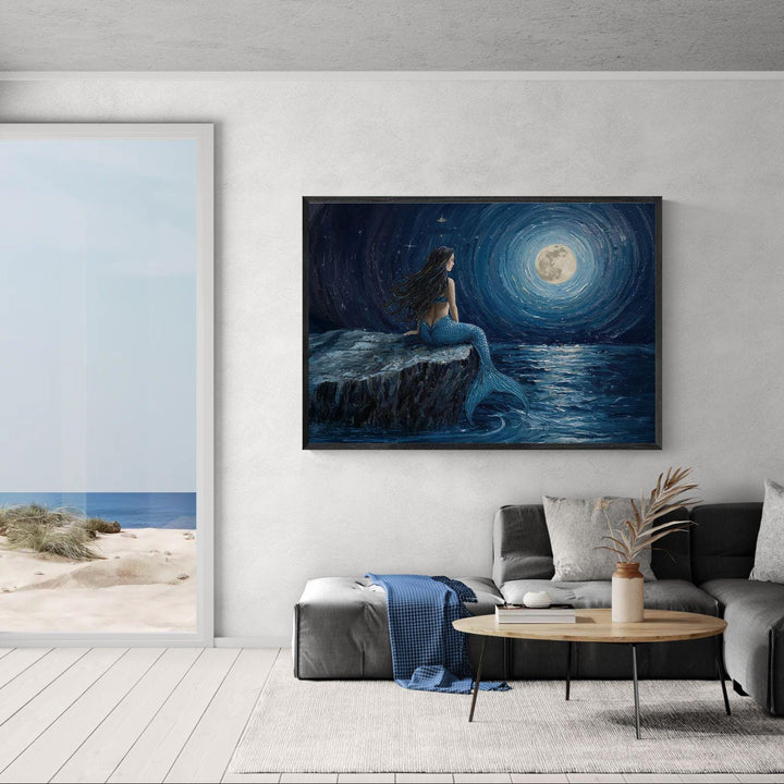 Night ocean mermaid wall art featuring a solitary mermaid seated by the sea at night beneath a glowing moon, painted in deep blue tones with a calm, mystical atmosphere