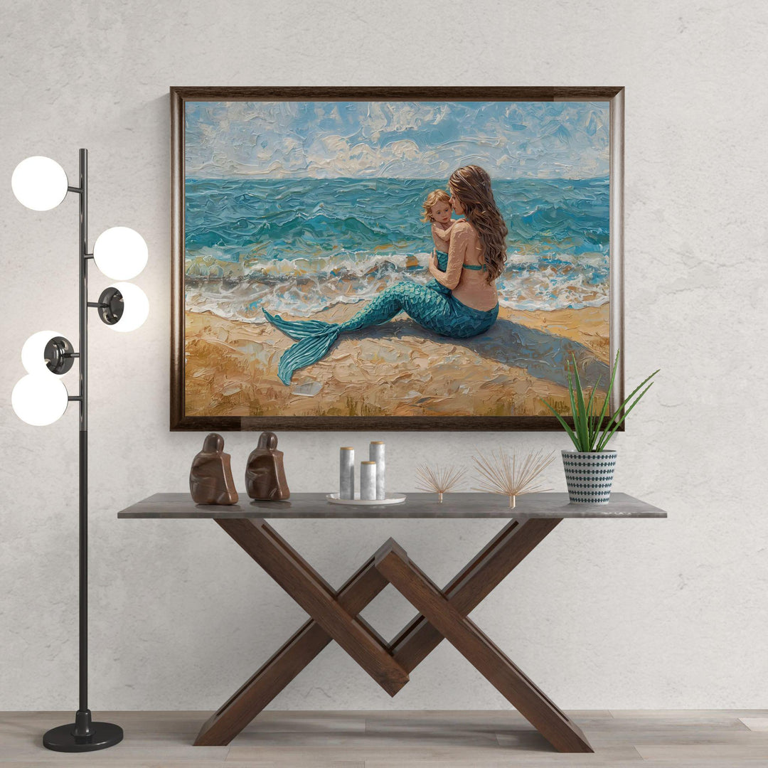 Painterly fantasy illustration of a mermaid mother sitting on a sandy beach holding her child while turquoise waves roll gently behind them.