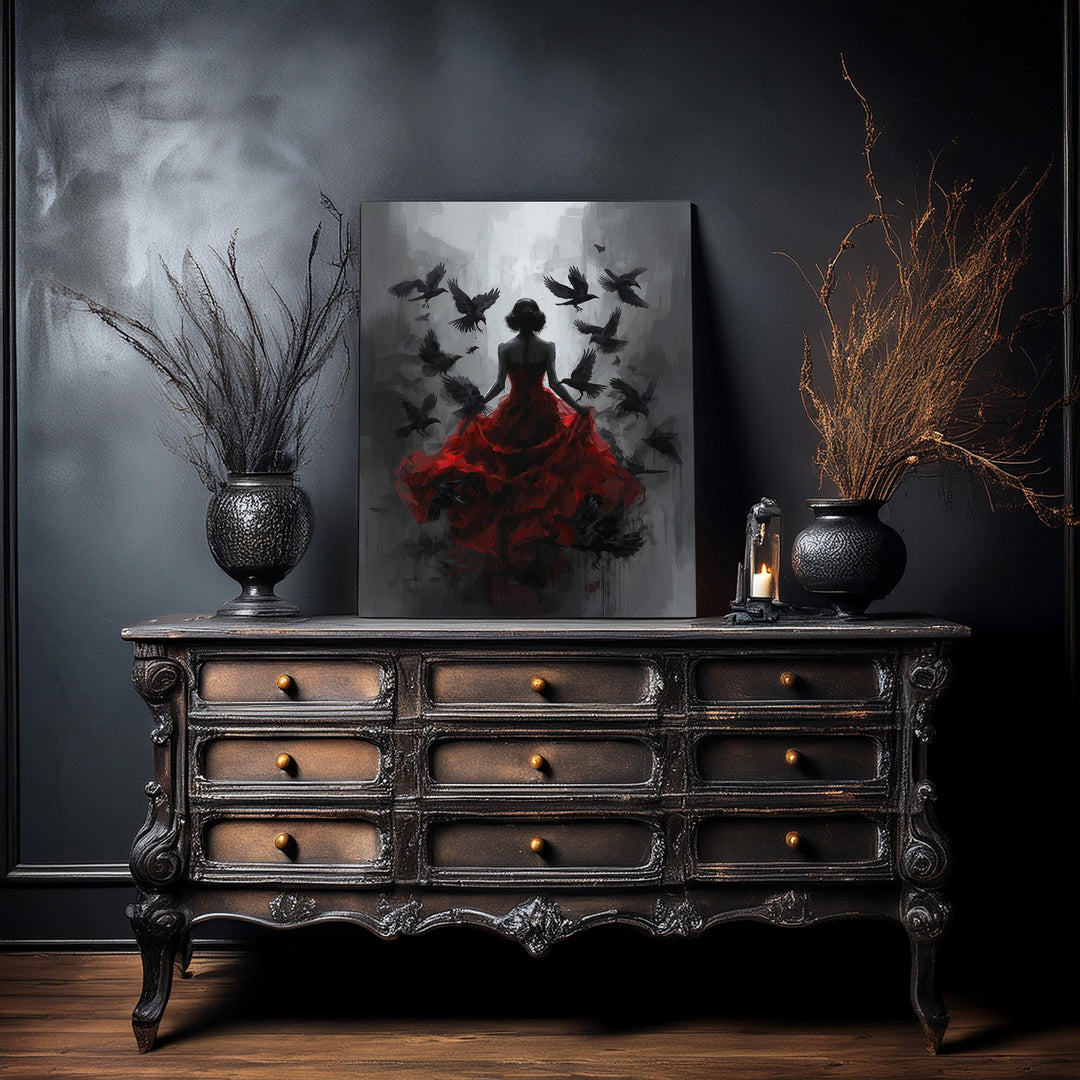 Dark gothic wall art featuring a mysterious woman in a flowing red dress with ravens flying around her in a moody shadowed setting.