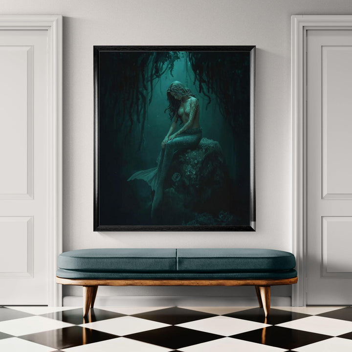 Dark mermaid wall art featuring a haunting siren seated beneath hanging kelp, glowing with teal magical markings in an underwater fantasy scene
