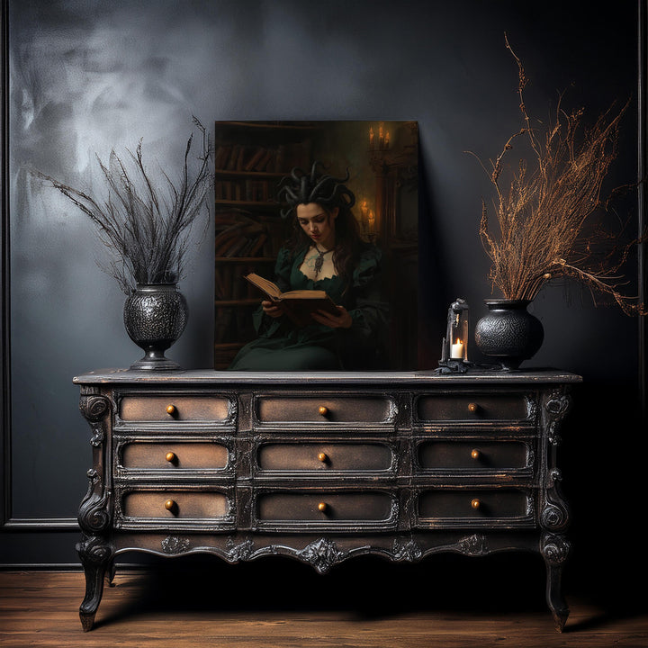 Dark academia fantasy wall art featuring a Medusa-inspired sorceress with serpent hair reading an ancient book inside a candlelit gothic library, surrounded by shelves of old tomes and warm shadows.