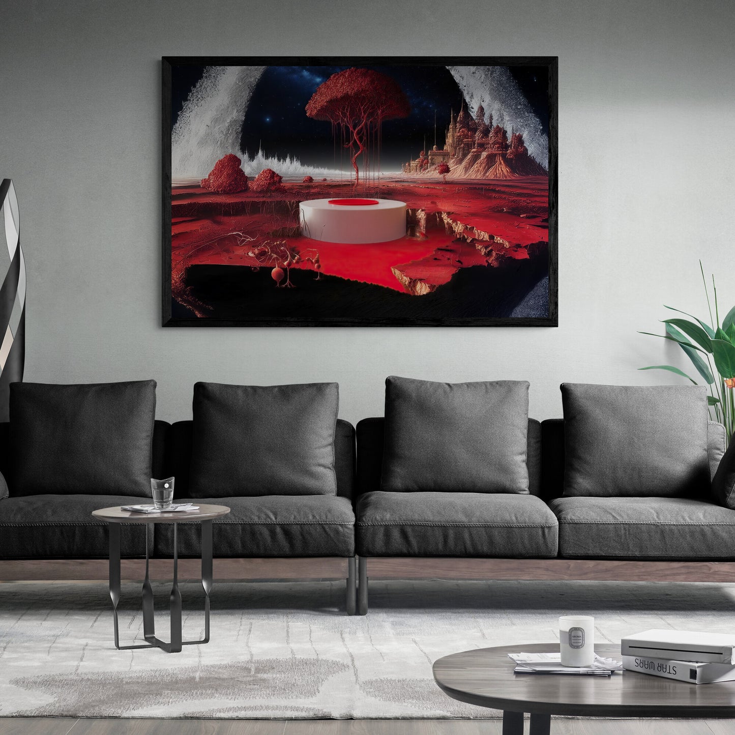 Framed artwork of a red and black abstract landscape above a gray sofa in a living room.